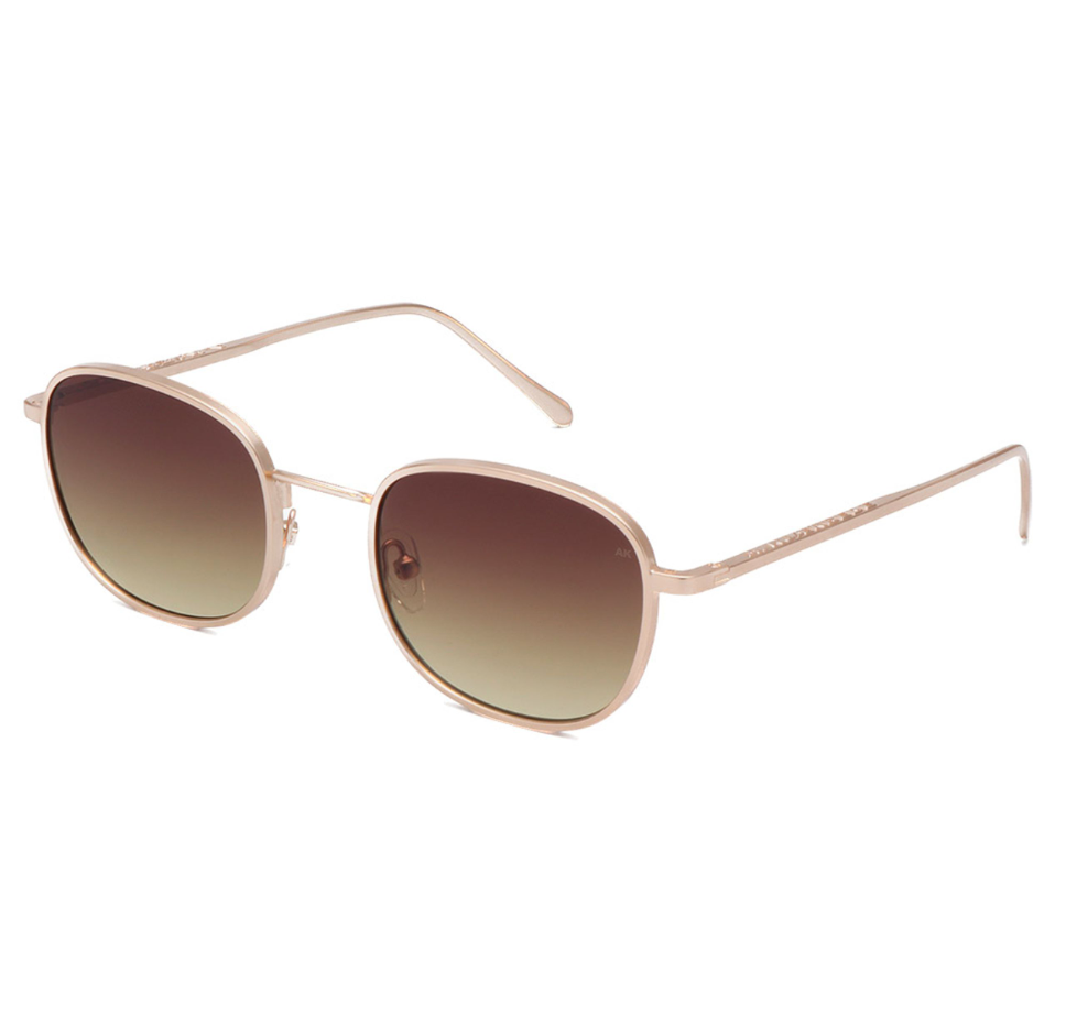 A. Kjærbede Hello Matte Gold sunglasses featuring Tenite Propionate temples and polycarbonate lenses.