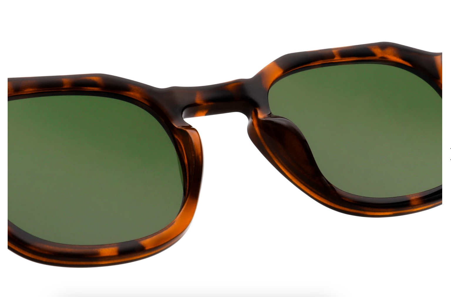 Close-up of A. Kjærbede Zan Havana sunglasses showcasing tortoise details.