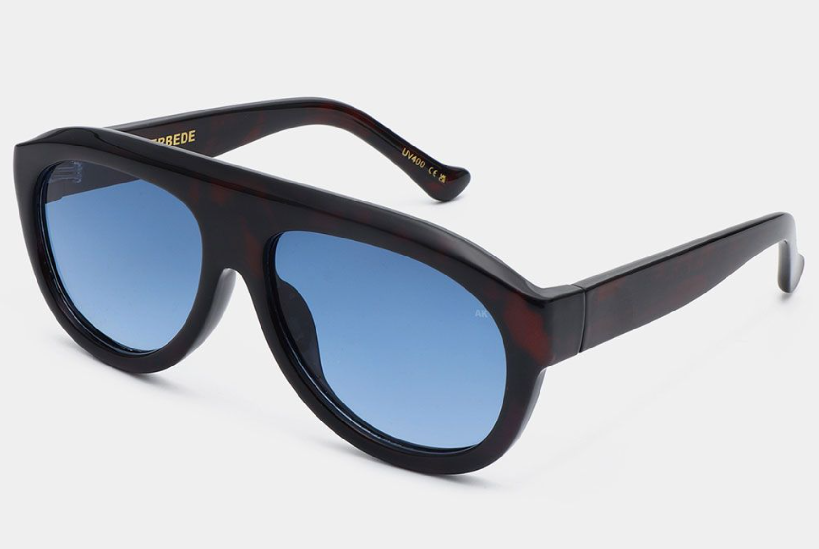 Close-up of Rio Demi Tortoise sunglasses by A. Kjærbede, highlighting eco-friendly materials.